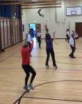 Staff and pupils practising Jerusalema activity