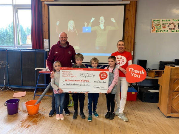 Ralph and pupils presenting cheque